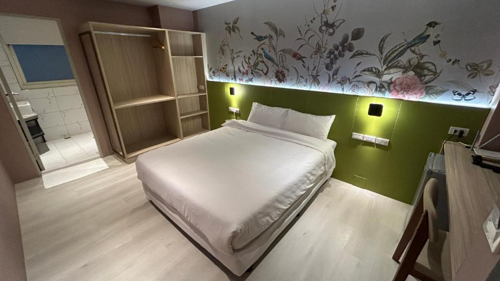 Letto o letti in una camera di Fashion Home Business Hotel 時尚居商旅