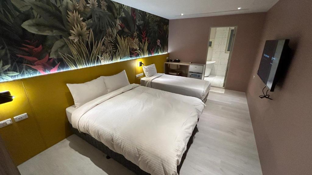 Letto o letti in una camera di Fashion Home Business Hotel 時尚居商旅