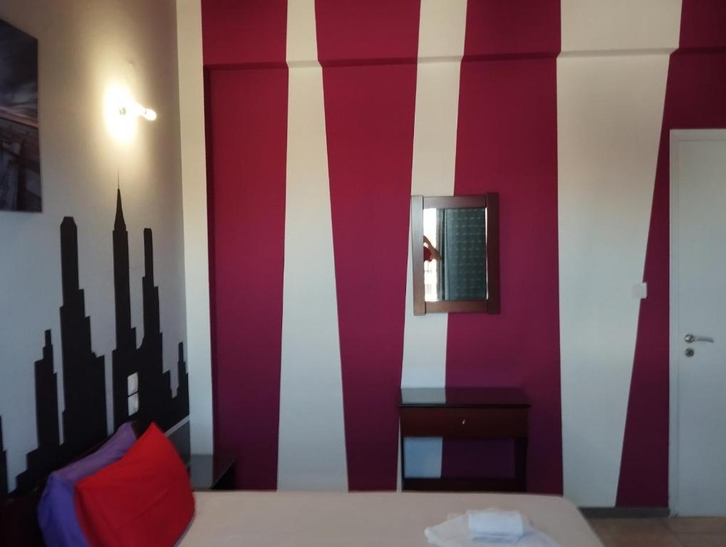 Postel nebo postele na pokoji v ubytování Hotel Neon Astron