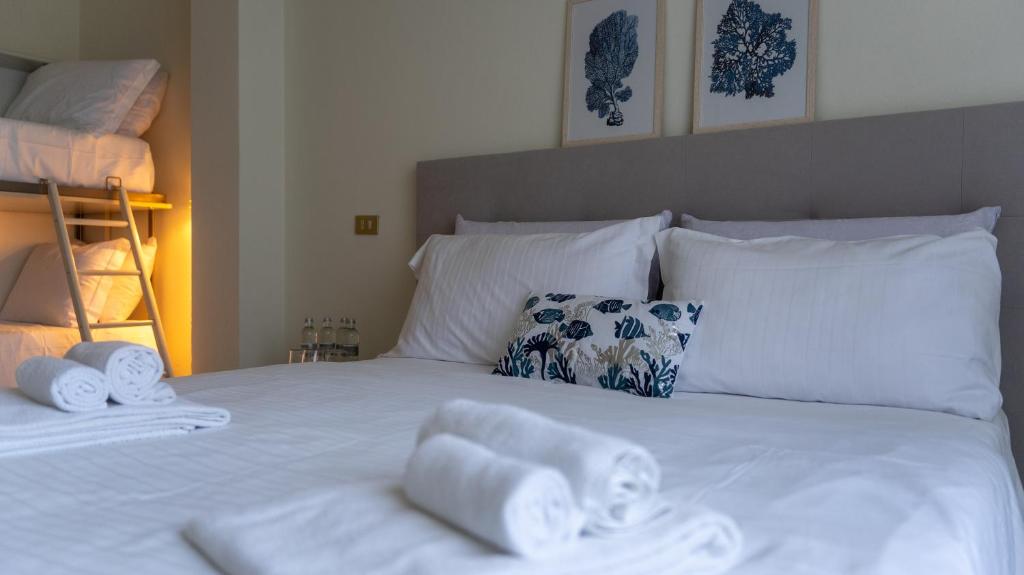 Posteľ alebo postele v izbe v ubytovaní Hotel Eden