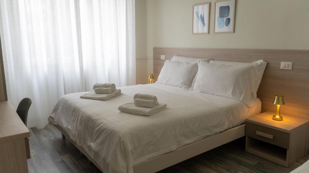 Posteľ alebo postele v izbe v ubytovaní Hotel Eden