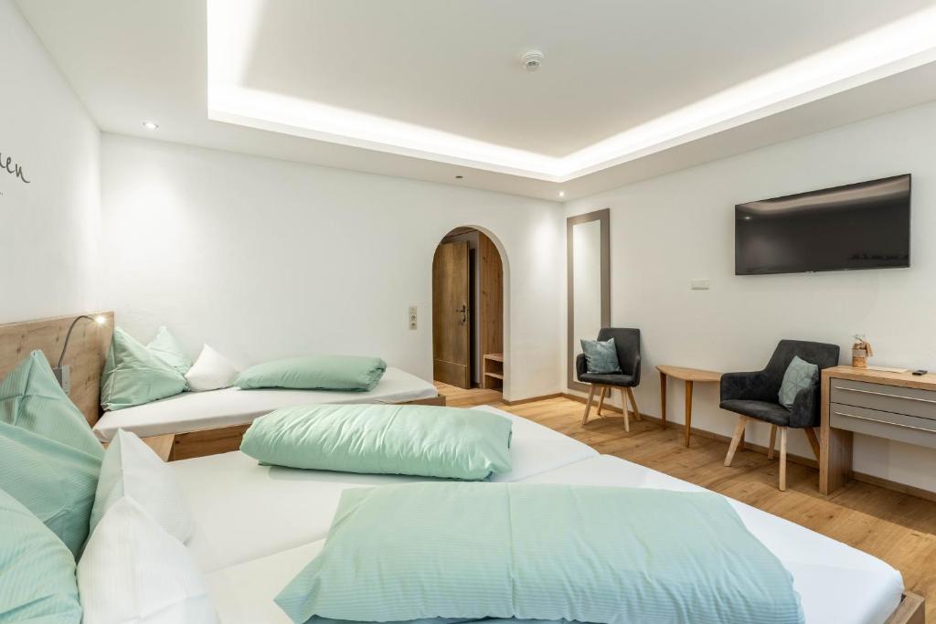 Postel nebo postele na pokoji v ubytování keyone rooms Gerlos