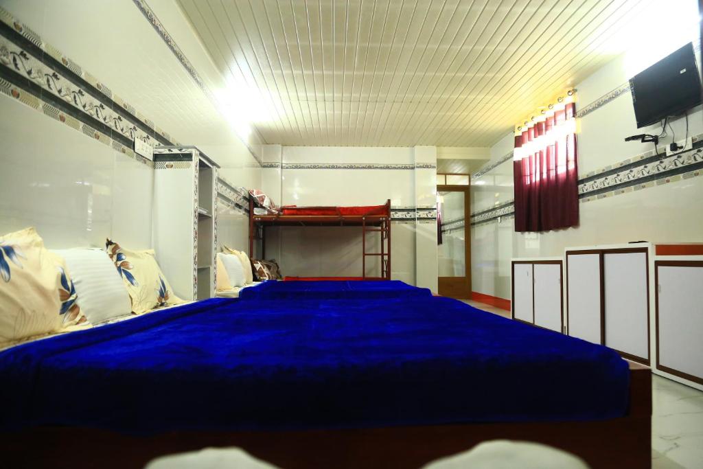 Postel nebo postele na pokoji v ubytování MSP Amma Cottage