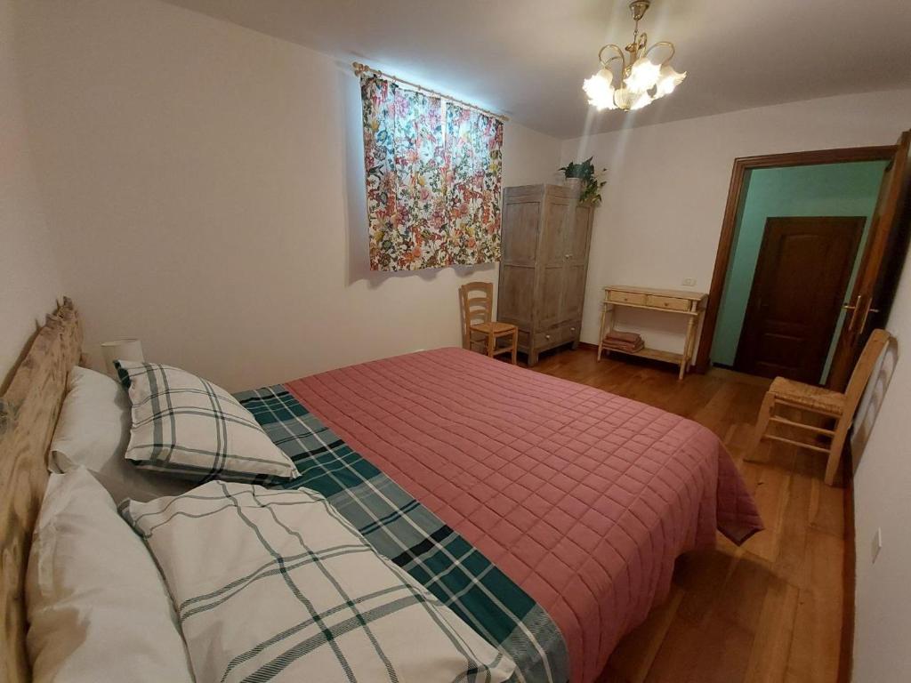 Postel nebo postele na pokoji v ubytování Nido Romantico