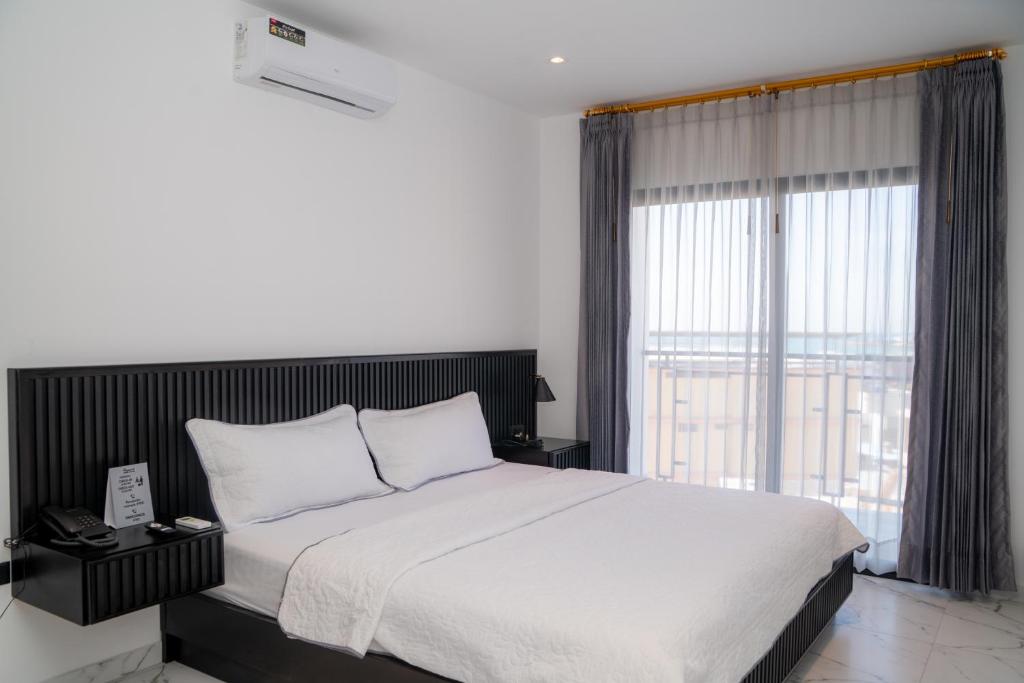 Postel nebo postele na pokoji v ubytování Manta Surf Hotel