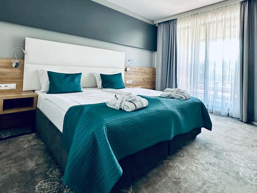 Postel nebo postele na pokoji v ubytování Hotel Limanova
