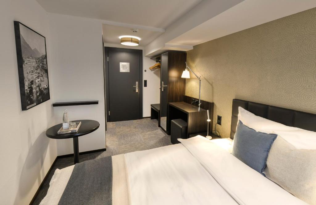 Postel nebo postele na pokoji v ubytování Boutique Hotel Reiser