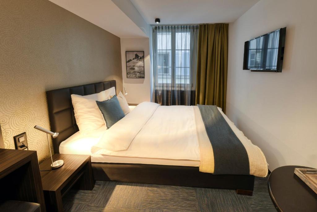 Postel nebo postele na pokoji v ubytování Boutique Hotel Reiser