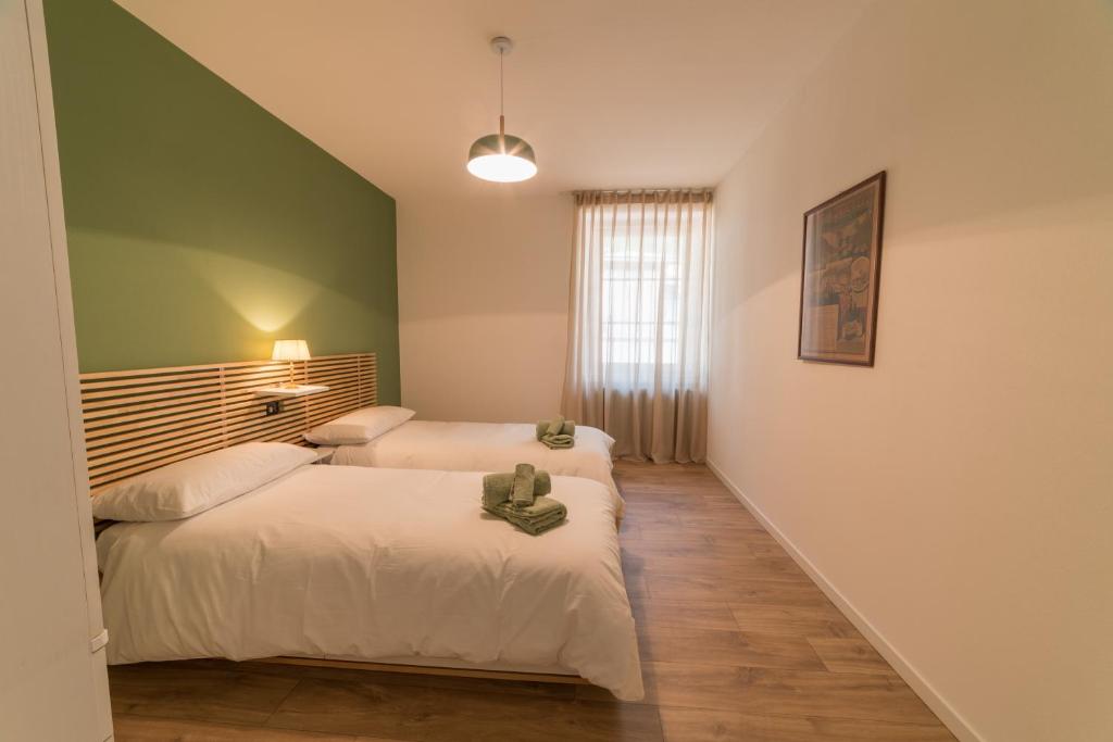 Postel nebo postele na pokoji v ubytování Villa Monari Apartment with Mountain View