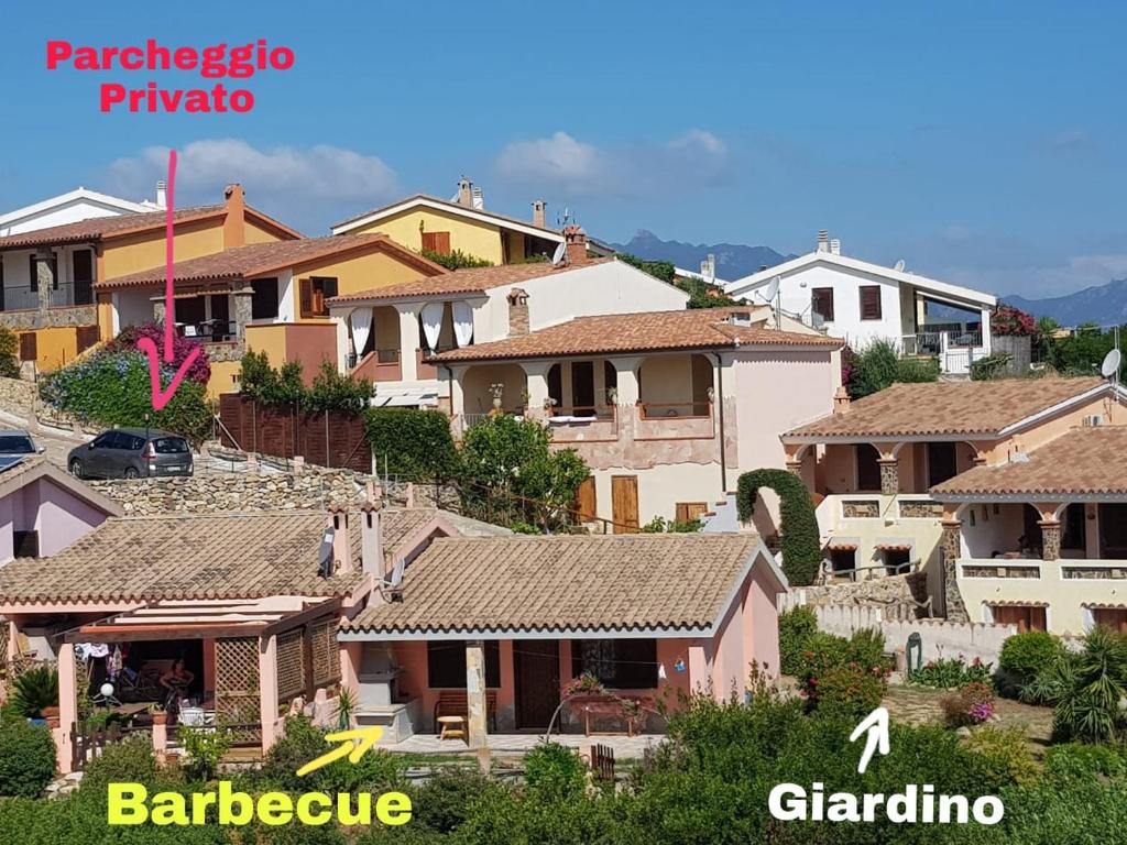 a group of houses on top of a hill at Casa con giardino con climatizzatore!!! in Costa Rei