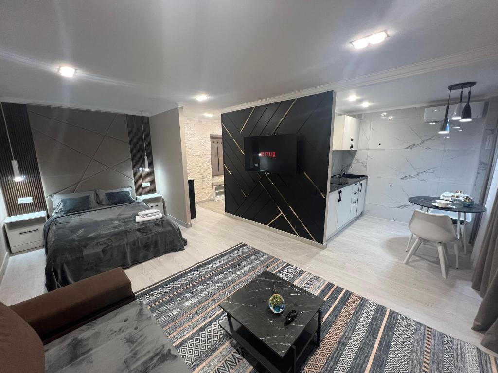 En eller flere senge i et værelse på Алиханова 10А