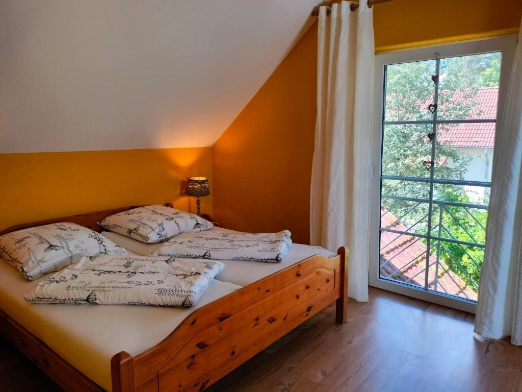 Postel nebo postele na pokoji v ubytování Ferienhaus Stille Liebe am Plauer See