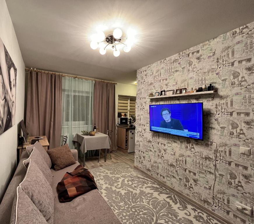 TV a/nebo společenská místnost v ubytování Tiny Paradise