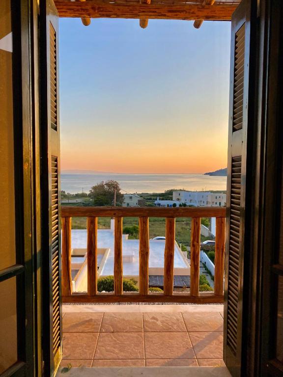a view of the ocean from a balcony at Cyclades Serenity Beach House in Kipri