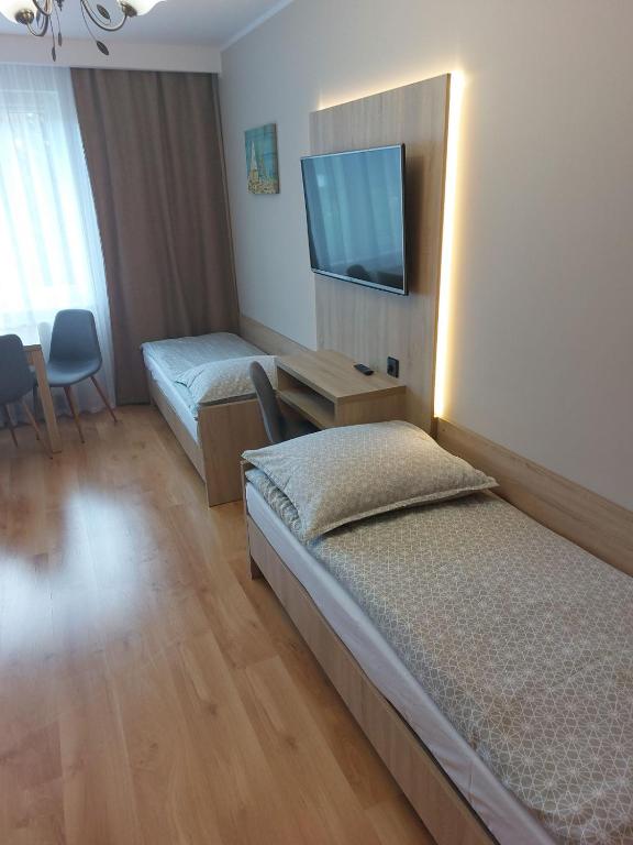 TV a/nebo společenská místnost v ubytování Willa Sternik