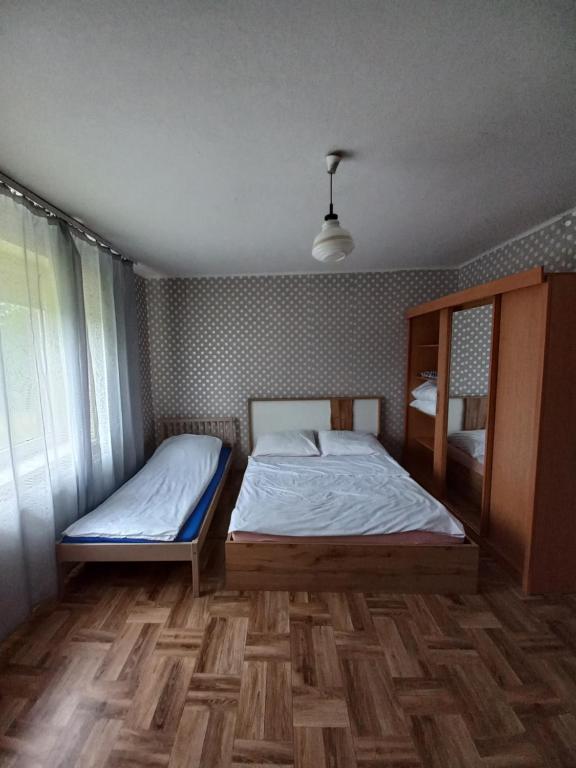 Posteľ alebo postele v izbe v ubytovaní Wiejski Relax pod "Żelaznym szlakiem"
