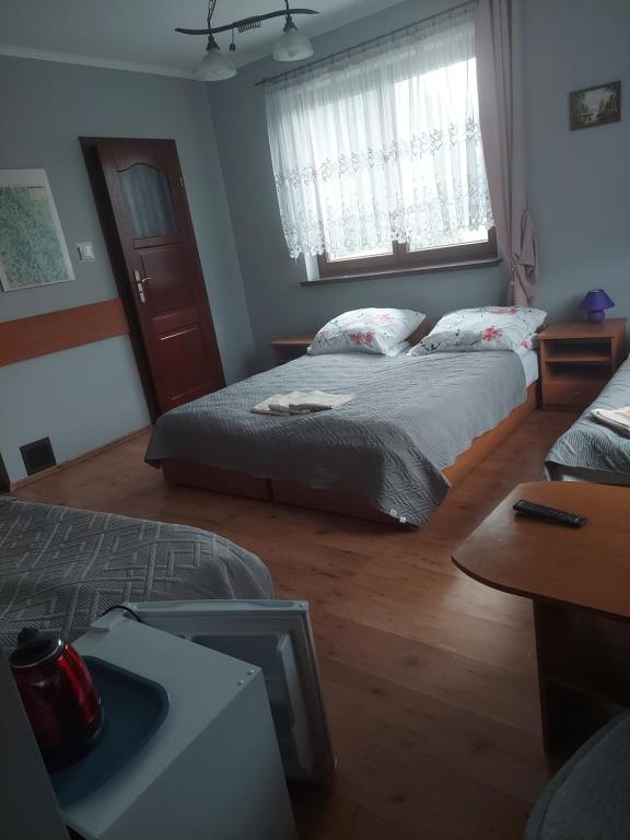 Posteľ alebo postele v izbe v ubytovaní Agroturystyka Zielony Ogród