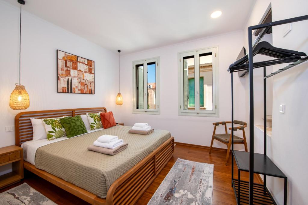 En eller flere senge i et værelse på Casa Elysium - Chania Old City