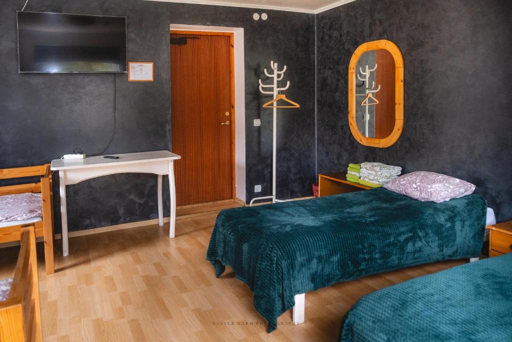 Postel nebo postele na pokoji v ubytování Pinska Guesthouse
