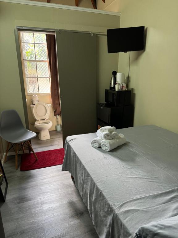 Postel nebo postele na pokoji v ubytování JJ Guest House
