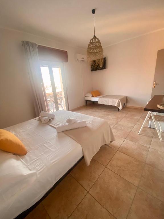 Postel nebo postele na pokoji v ubytování VitaLenta Rooms