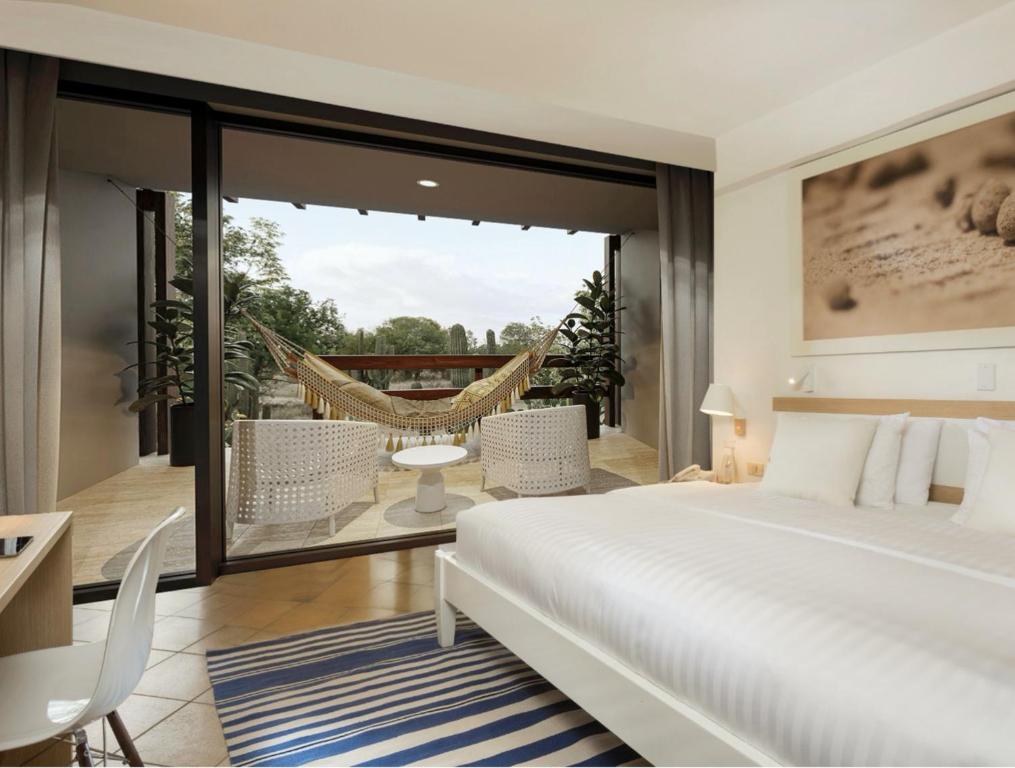 Postel nebo postele na pokoji v ubytování Finch Bay Galapagos Hotel
