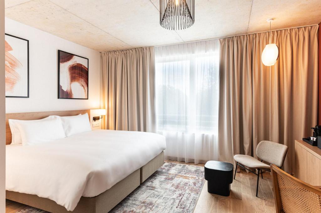 Postel nebo postele na pokoji v ubytování voco Beaune , Cité des Vins by IHG