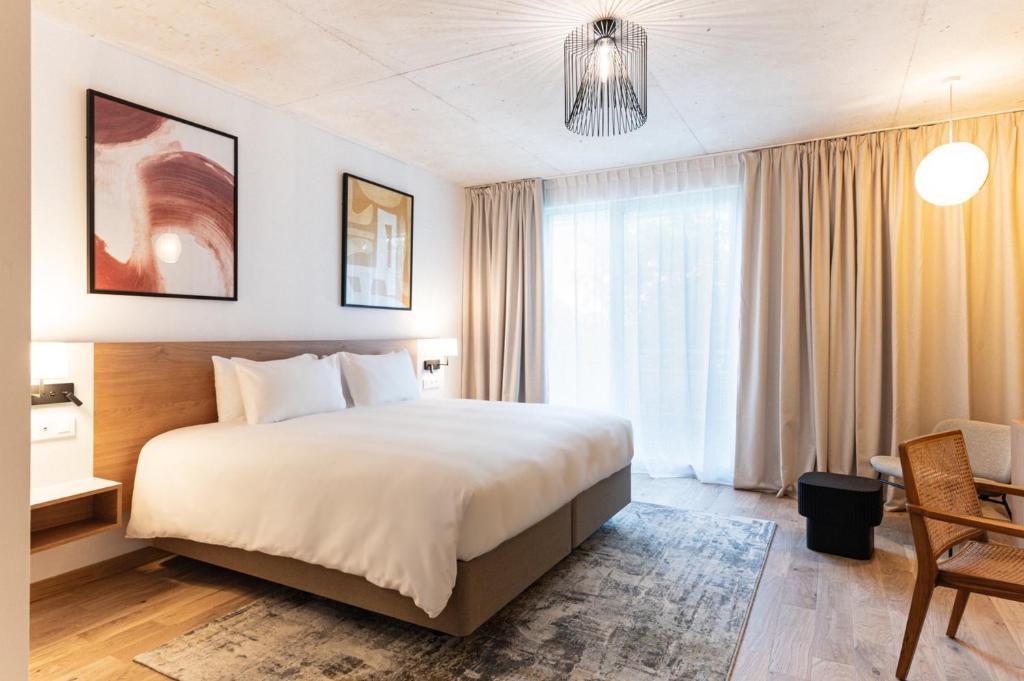 Postel nebo postele na pokoji v ubytování voco Beaune , Cité des Vins by IHG