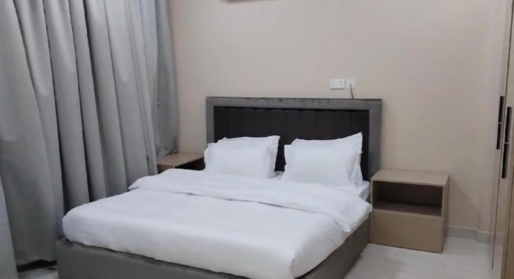 Postel nebo postele na pokoji v ubytování Baytna Hotel Apartments بيتنا للشقق الفندقية