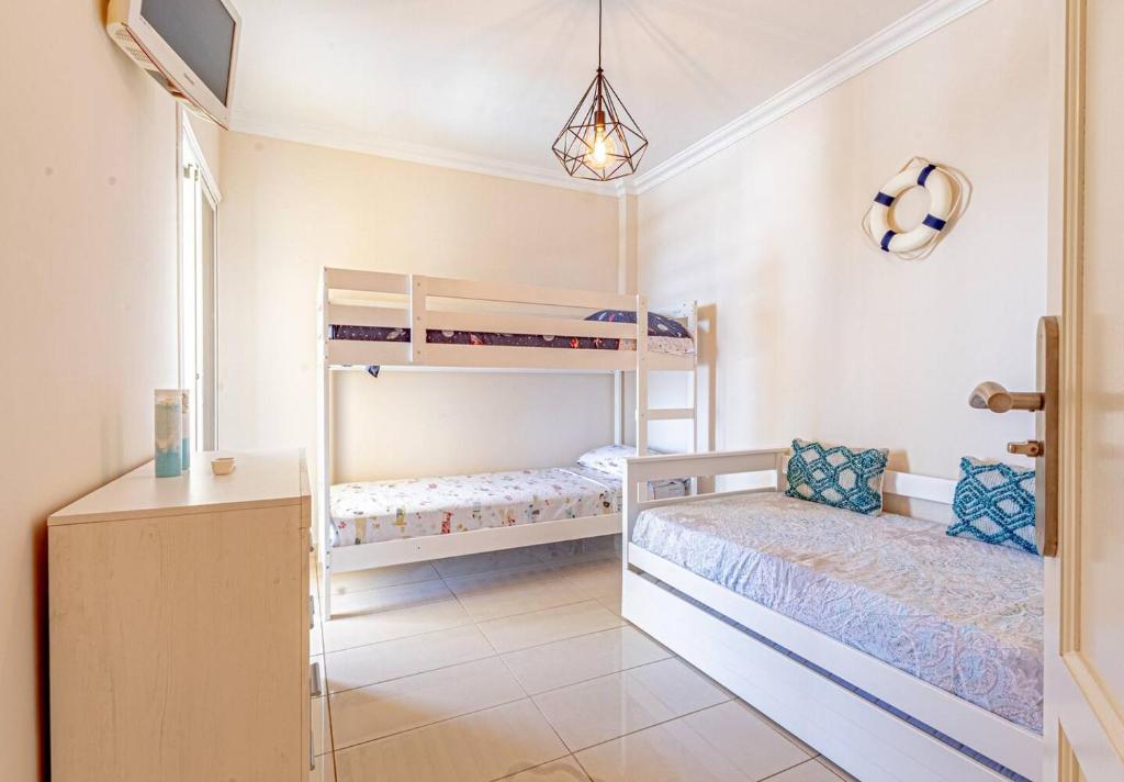 Postel nebo postele na pokoji v ubytování La Perla Playa Apt Dream Homes Tenerife