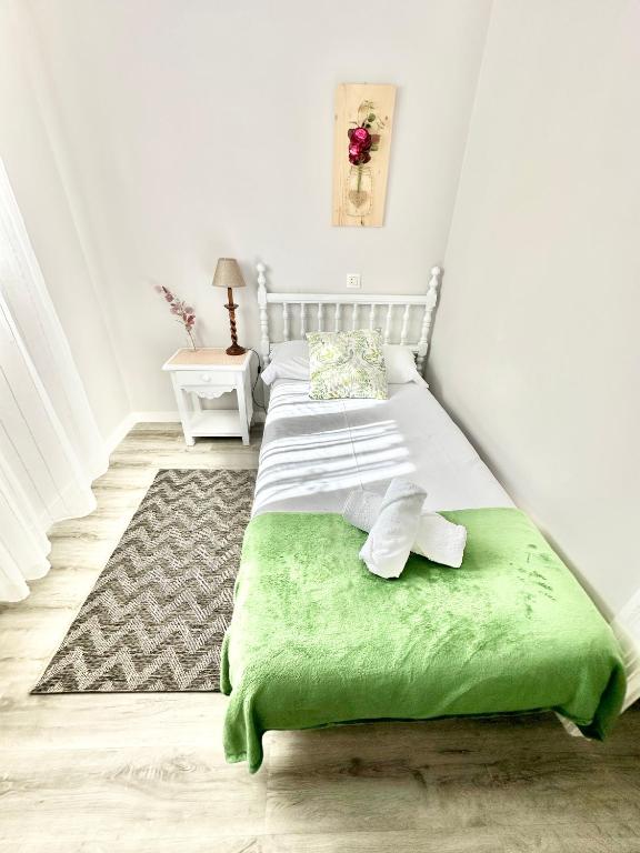 Postel nebo postele na pokoji v ubytování La Casa de la Buganvilla