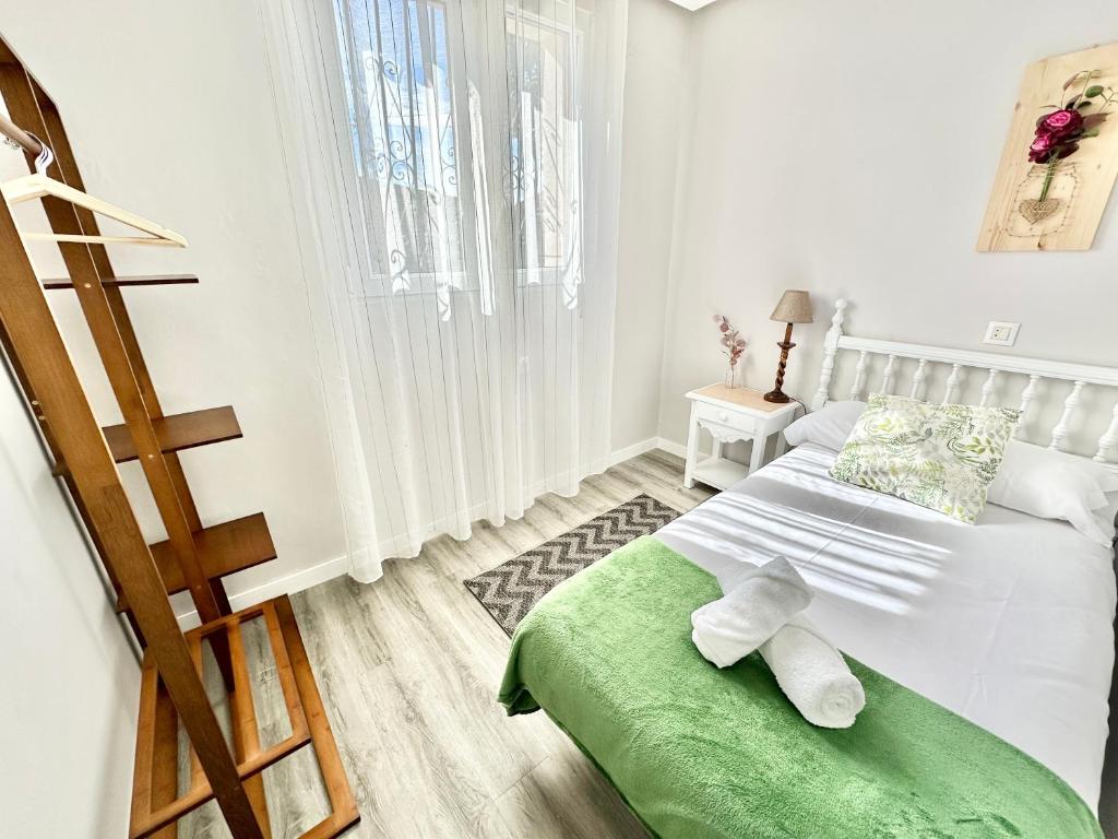 Postel nebo postele na pokoji v ubytování La Casa de la Buganvilla