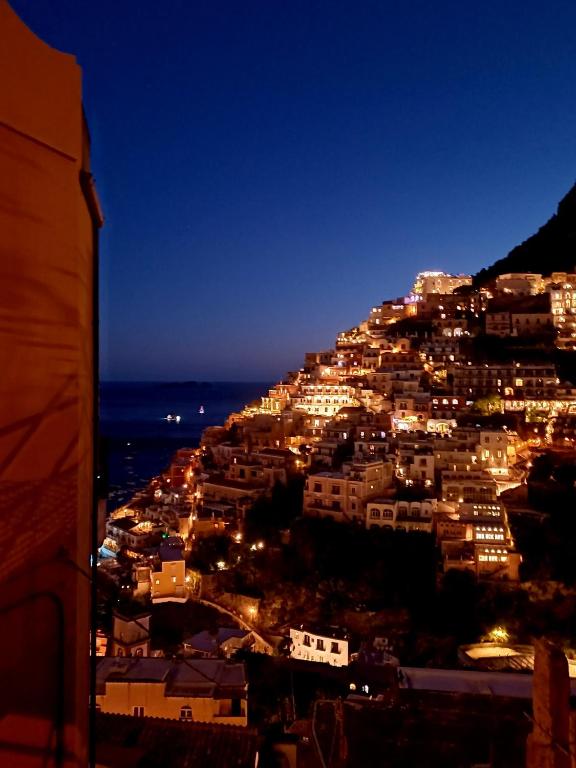 a view of a city at night at Sosò Art b&b in Positano