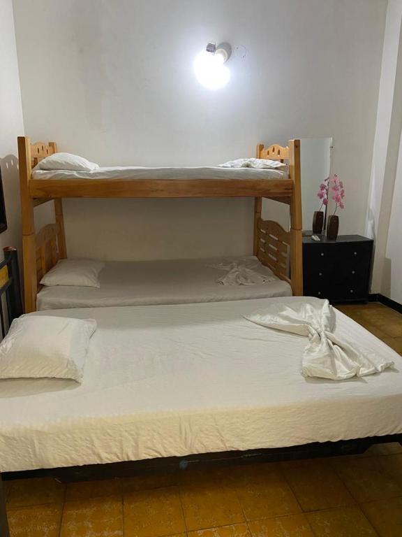 Postel nebo postele na pokoji v ubytování Hospedaje Carmelita Tocaima