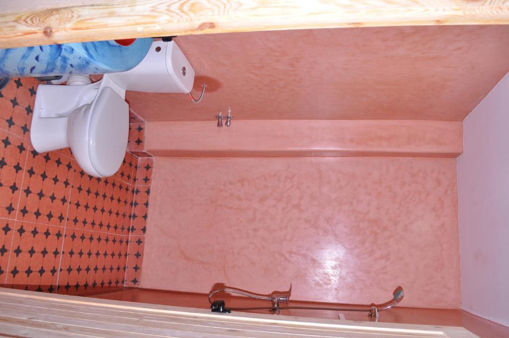 a bathroom with a shower with a toilet at Hôtel Kasbah Dades M Goun in Ait Sedrate Sahl Gharbia