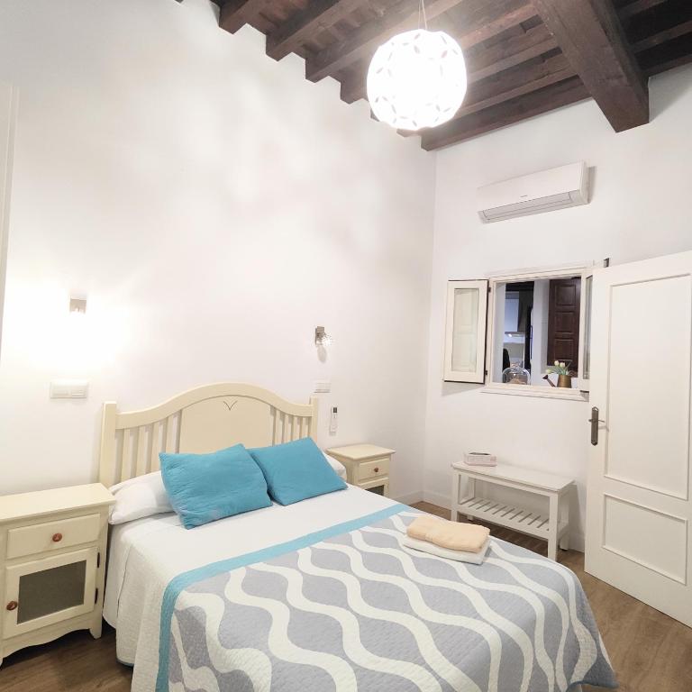 Posteľ alebo postele v izbe v ubytovaní Apartamento Tres Culturas