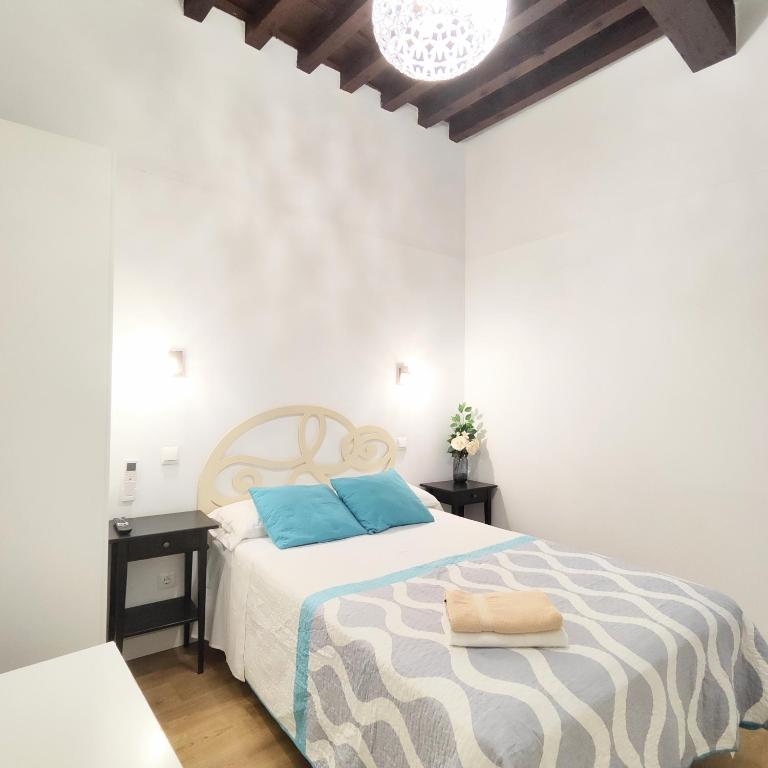 Posteľ alebo postele v izbe v ubytovaní Apartamento Tres Culturas