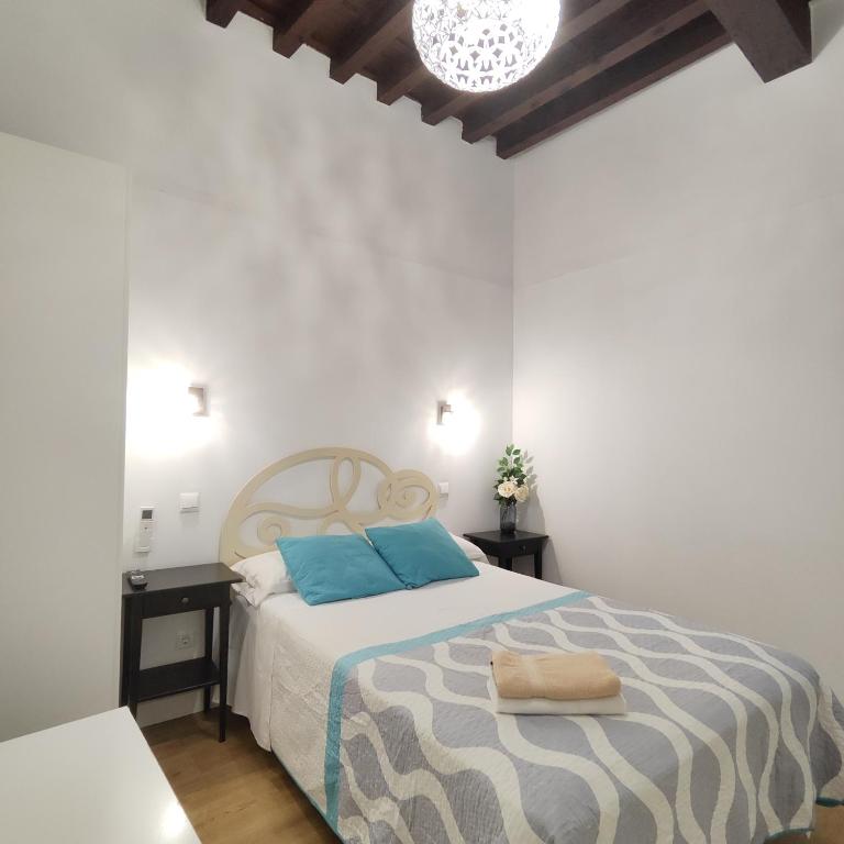 Posteľ alebo postele v izbe v ubytovaní Apartamento Tres Culturas