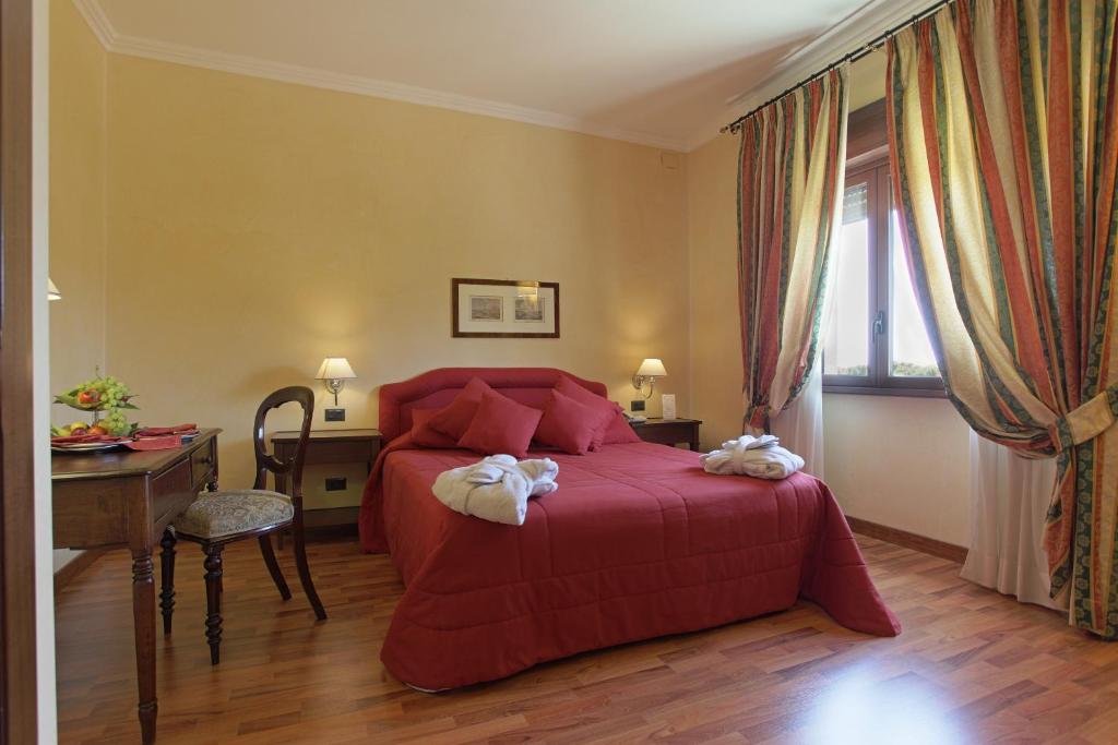 Postel nebo postele na pokoji v ubytování Hotel Della Valle