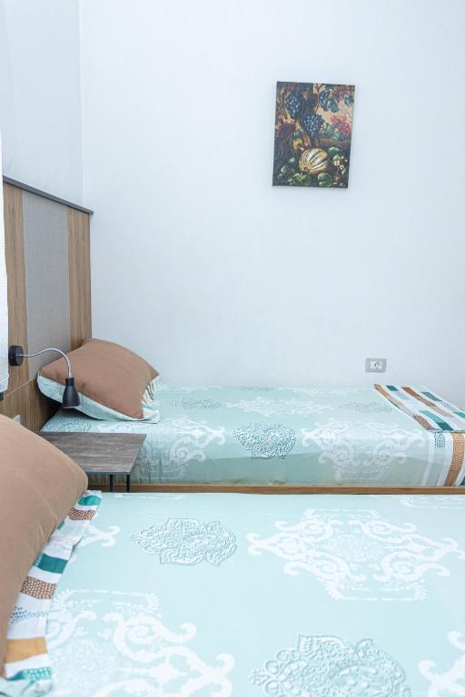 Postel nebo postele na pokoji v ubytování Hotel Olti