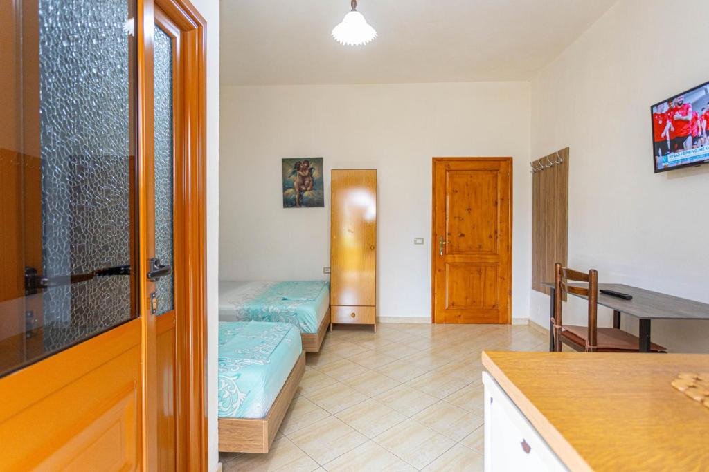 Postel nebo postele na pokoji v ubytování Hotel Olti