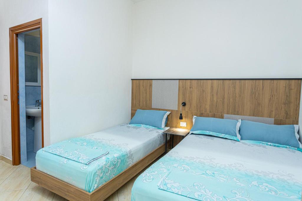 Postel nebo postele na pokoji v ubytování Hotel Olti