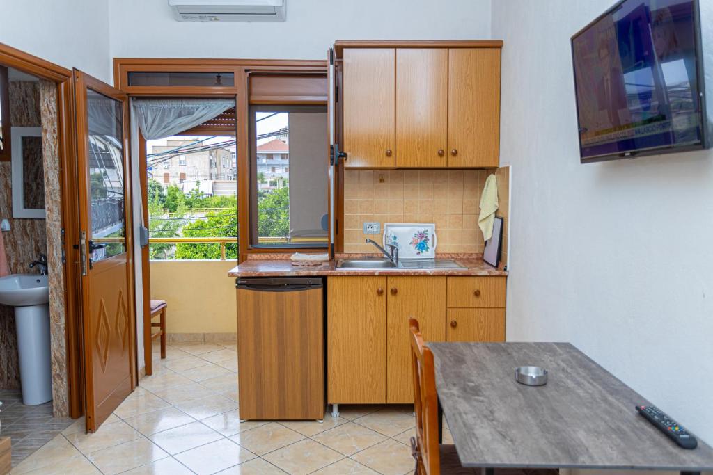 Kuchyň nebo kuchyňský kout v ubytování Hotel Olti