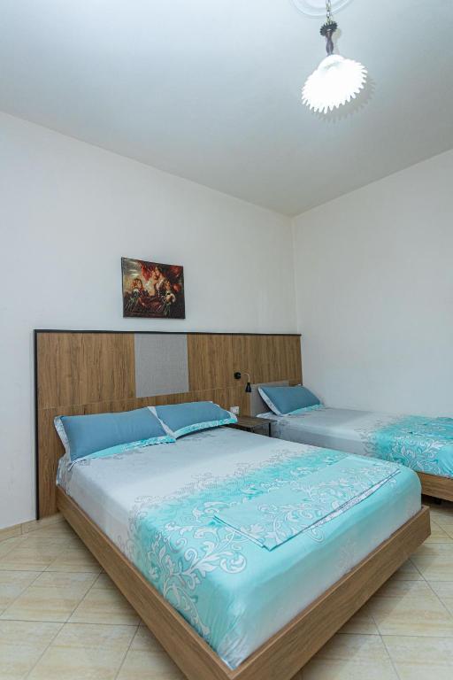 Postel nebo postele na pokoji v ubytování Hotel Olti