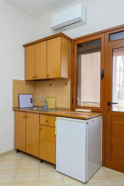 Kuchyň nebo kuchyňský kout v ubytování Hotel Olti