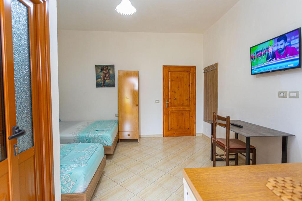 Postel nebo postele na pokoji v ubytování Hotel Olti