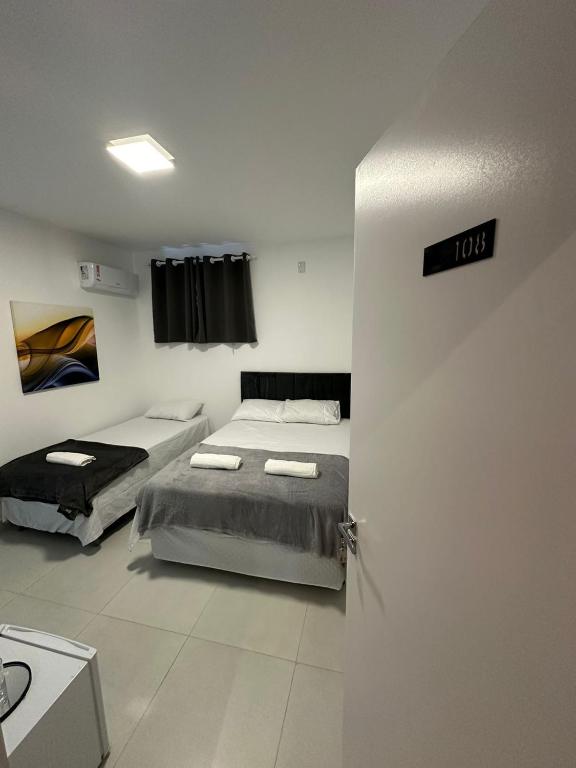 Postel nebo postele na pokoji v ubytování Torre Hotel