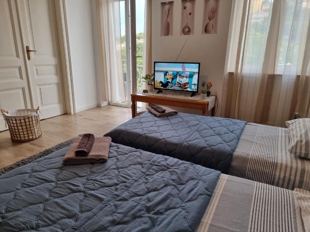Televízia a/alebo spoločenská miestnosť v ubytovaní ***Apartment Magic &SummerVibes***
