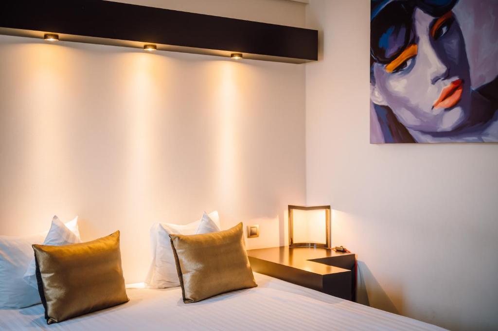 Postel nebo postele na pokoji v ubytování Plaza V Hotel