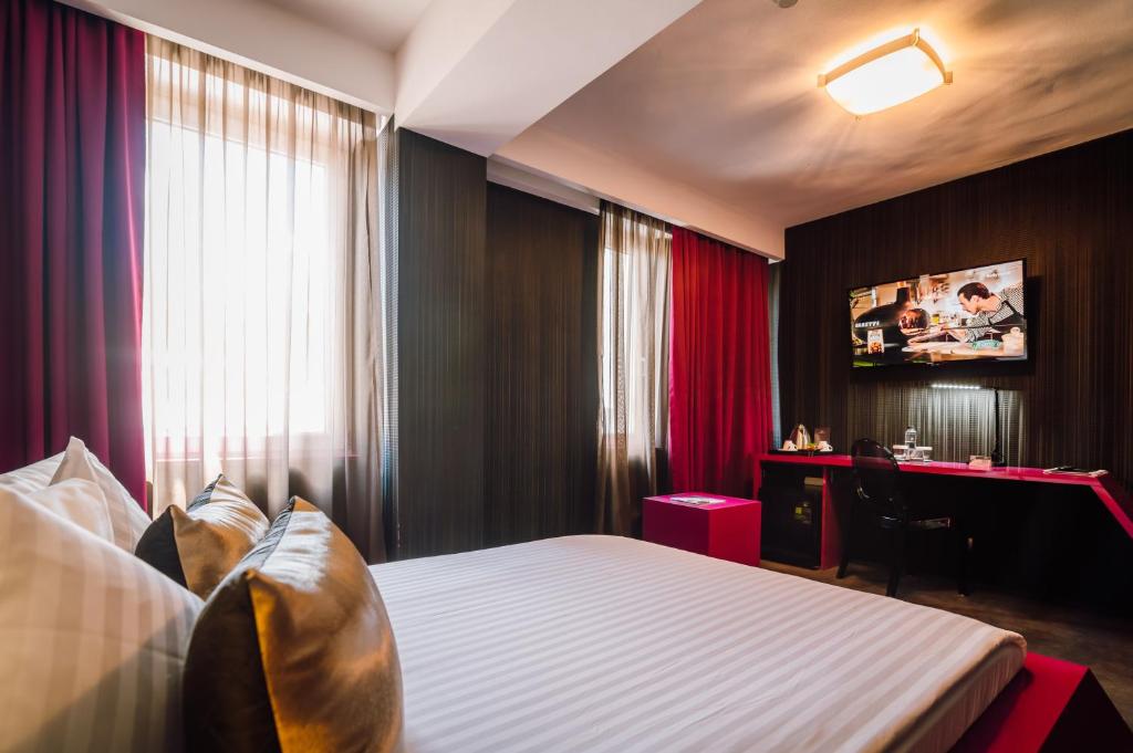 Postel nebo postele na pokoji v ubytování Plaza V Hotel